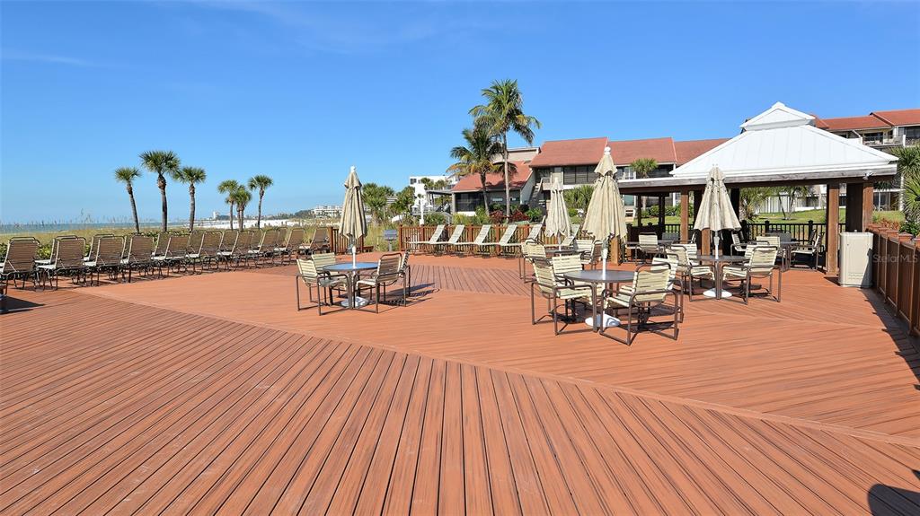 6204 Midnight Pass Road, Unit 205 Sarasota, FL 34242 - Photo 39 of 62 a view of a swimming pool with sitting area