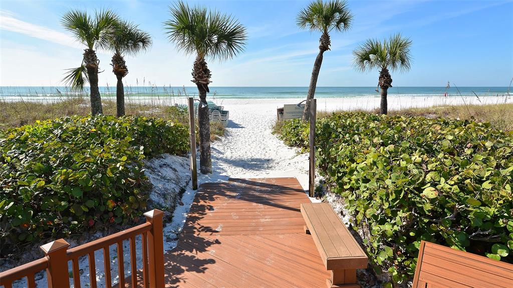 6204 Midnight Pass Road, Unit 205 Sarasota, FL 34242 - Photo 45 of 62 a view of ocean view with a garden