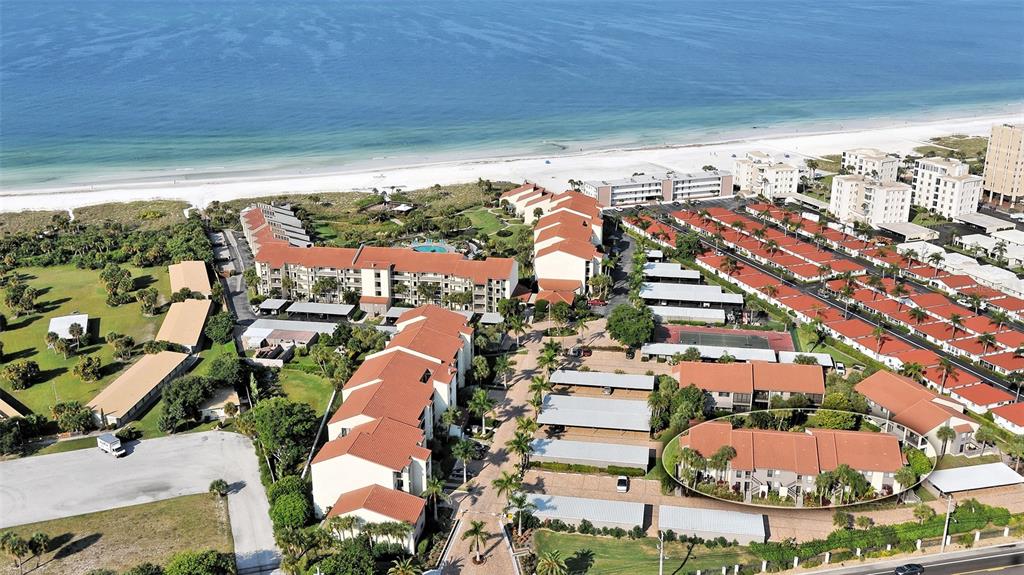 6204 Midnight Pass Road, Unit 205 Sarasota, FL 34242 - Photo 55 of 62 an aerial view of residential houses with outdoor space