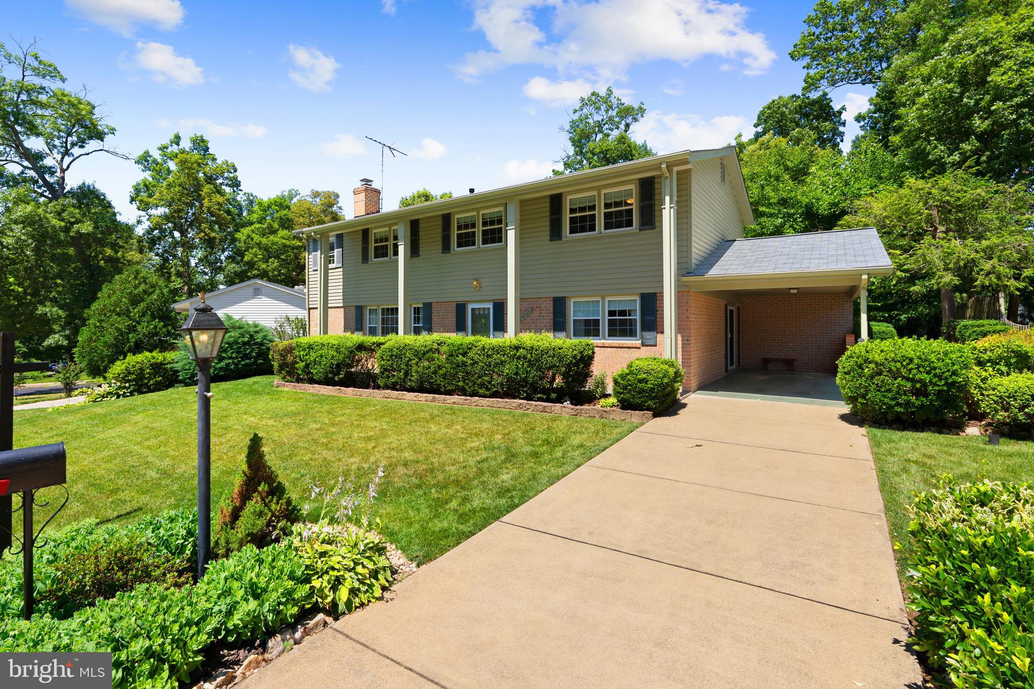 6703 Red Jacket Road Springfield, VA 22152 - Photo 2 of 31 Long concrete driveway and Carport with Attic