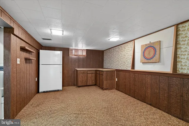 a view of a house with yard and tree s