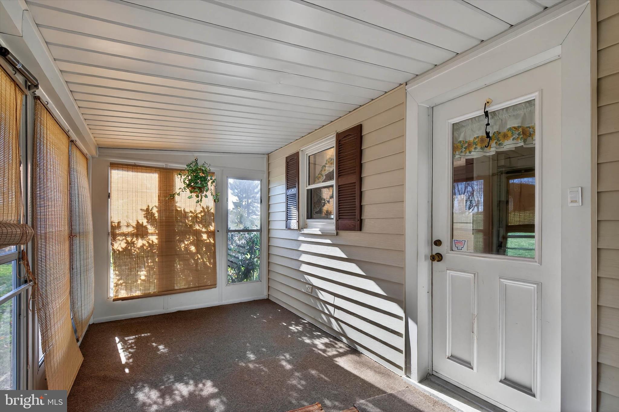 319 Druid Hill Road Mountville, PA 17554 - Photo 33 of 62 a view of a porch with a bench