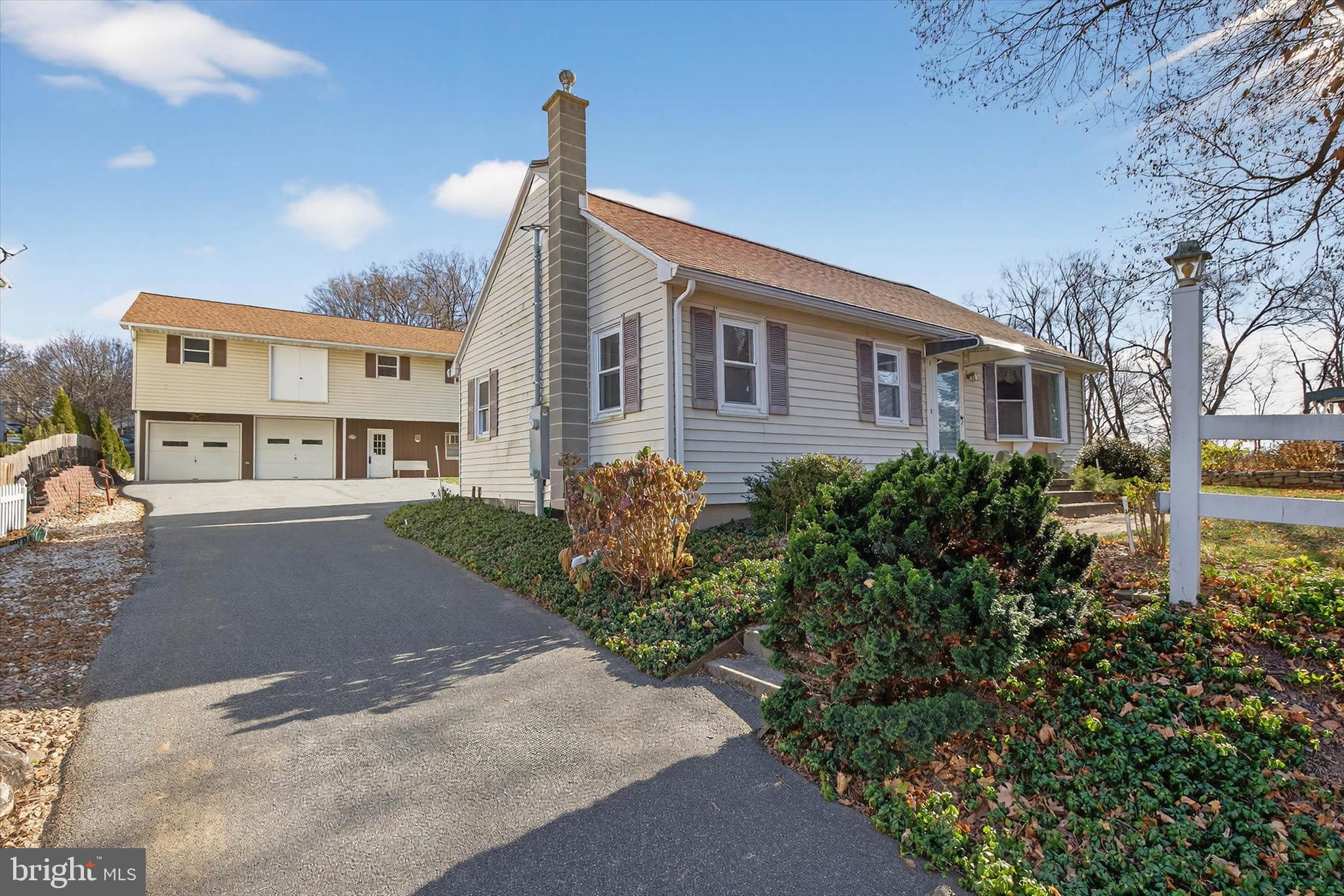 319 Druid Hill Road Mountville, PA 17554 - Photo 4 of 62 a front view of a house with a yard and trees