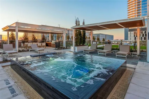 a view of a house with backyard porch and sitting area