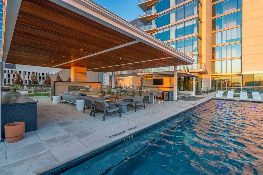7901 Windrose Avenue, Unit 2104 Plano, TX 75024 - Photo 19 of 39 a view of a patio with table and chairs