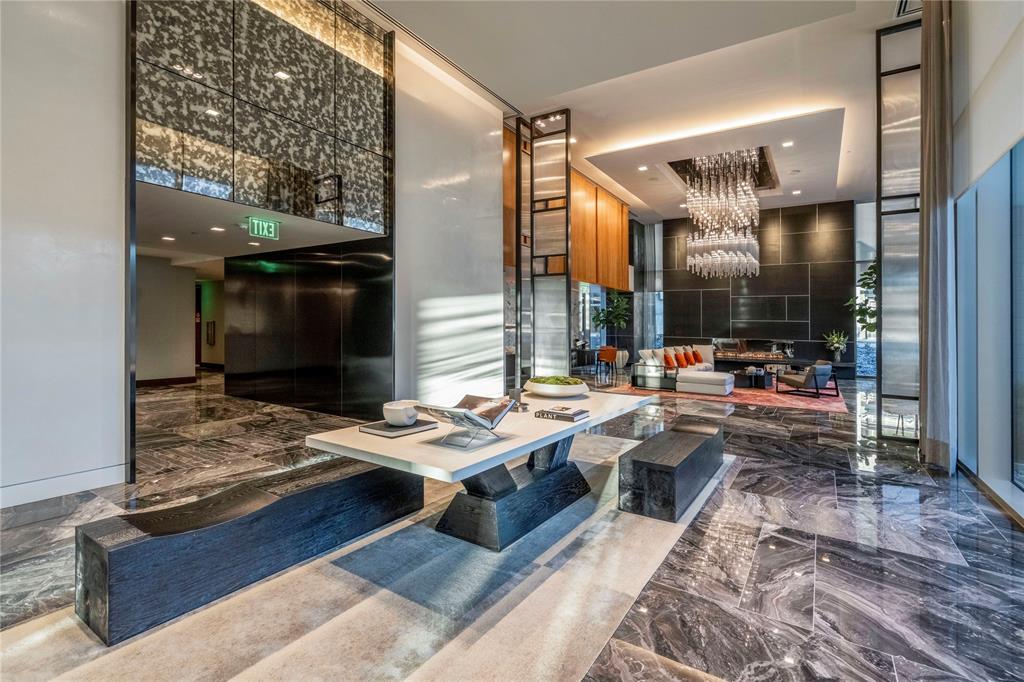 7901 Windrose Avenue, Unit 2104 Plano, TX 75024 - Photo 2 of 39 a room with lots of tables and chairs