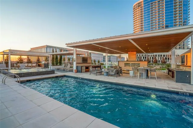 a view of a patio with swimming pool table and chairs