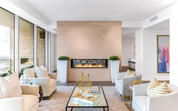 a living room with furniture and a rug
