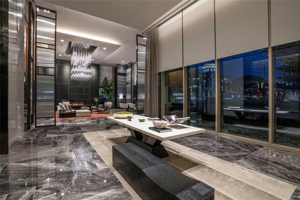 7901 Windrose Avenue, Unit 2104 Plano, TX 75024 - Photo 33 of 39 a living room with couches a table and chairs