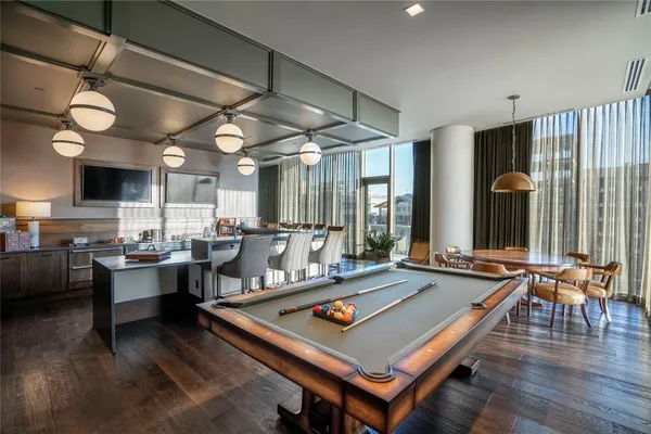 a room with lots of furniture and view of living room