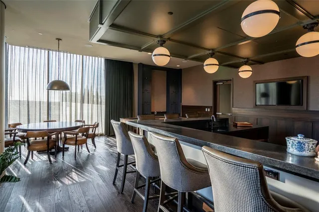 a large kitchen with a table and chairs