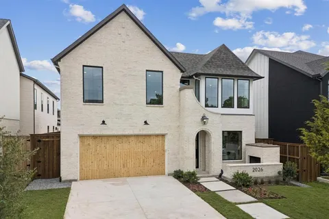 a front view of a house with yard