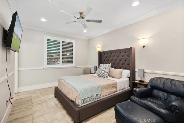 a bathroom with a sink a toilet a mirror and shower