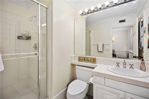 a living room with furniture a rug and a book shelf