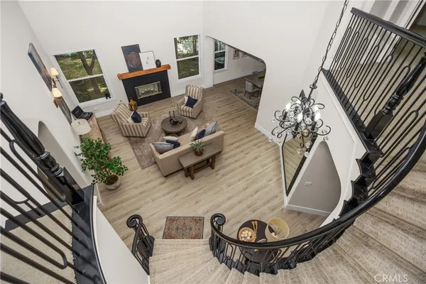 a bedroom with a bed mirror and window