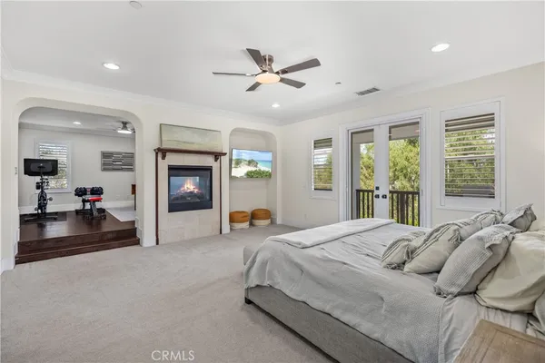a spacious bathroom with a tub double sink and mirror