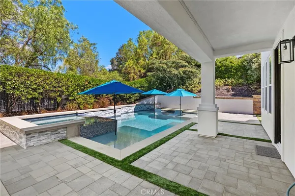 a table and chairs sitting in the garden