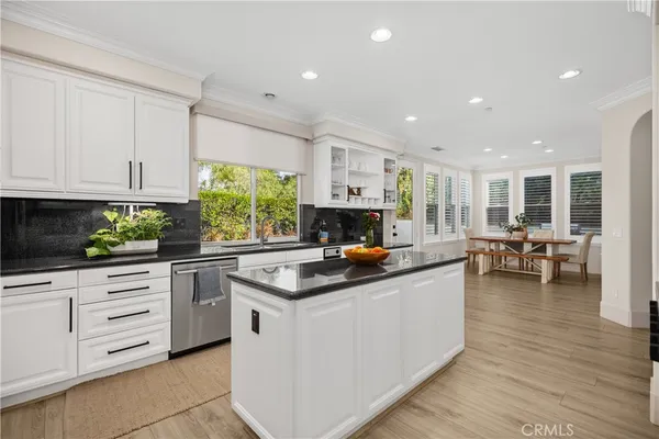 a kitchen with kitchen island granite countertop lots of counter top space and living room