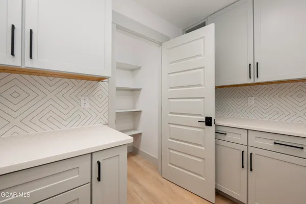 a bathroom with a double vanity sink and mirror