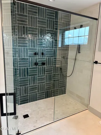 a view of a swimming pool with an outdoor seating