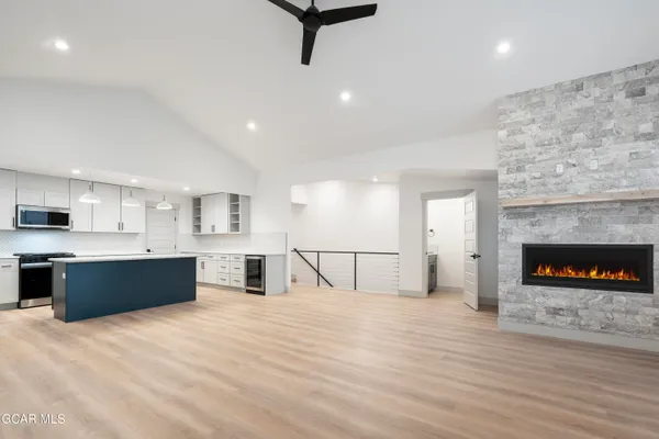 a kitchen with a sink stove and cabinets