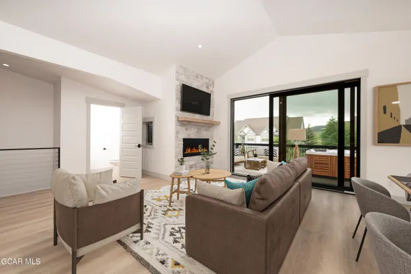 a kitchen with granite countertop white cabinets and stainless steel appliances