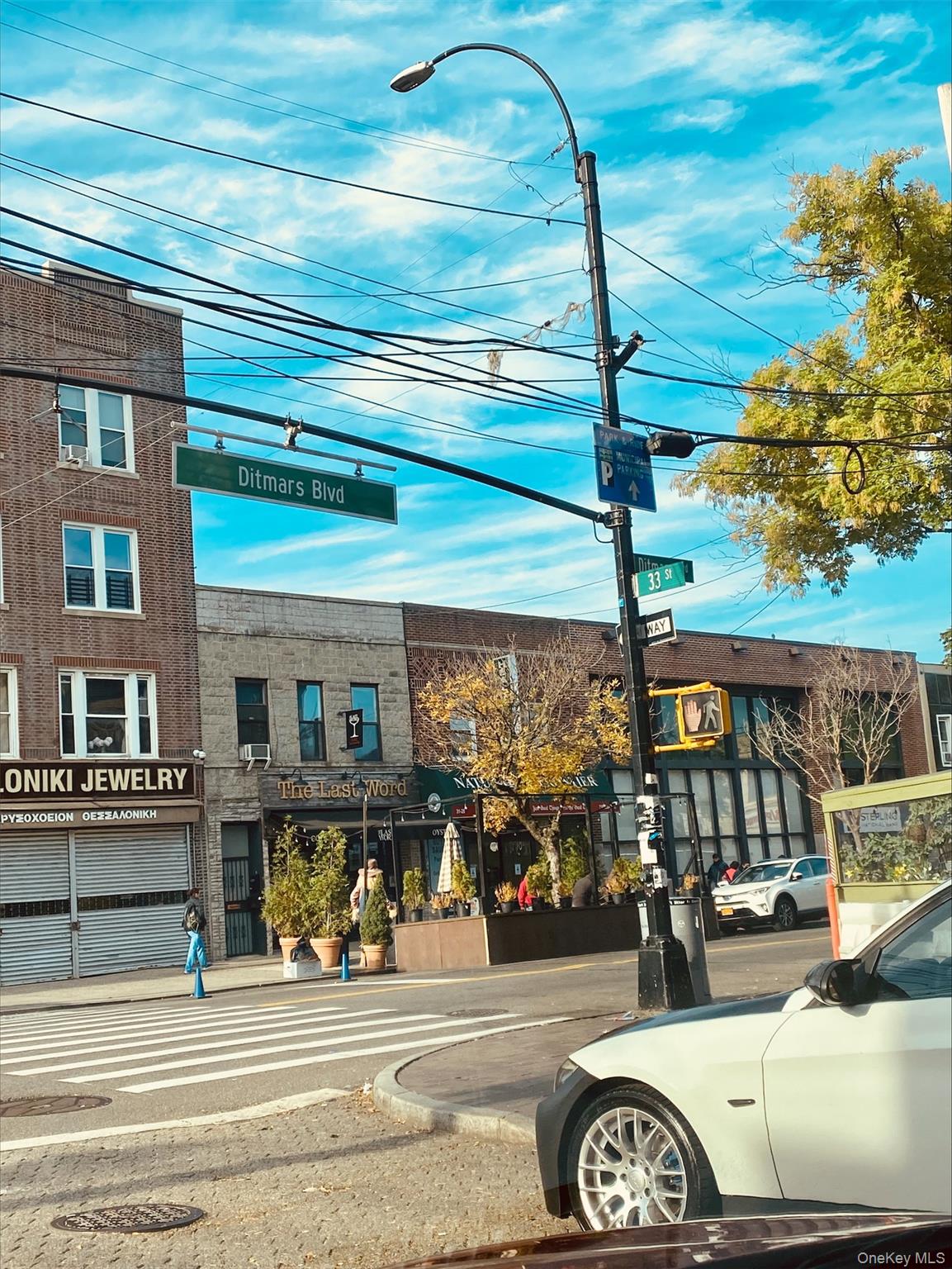21-67 33rd Street, Unit 4G Queens, NY 11105 - Photo 3 of 11 a front view of a building with parking area
