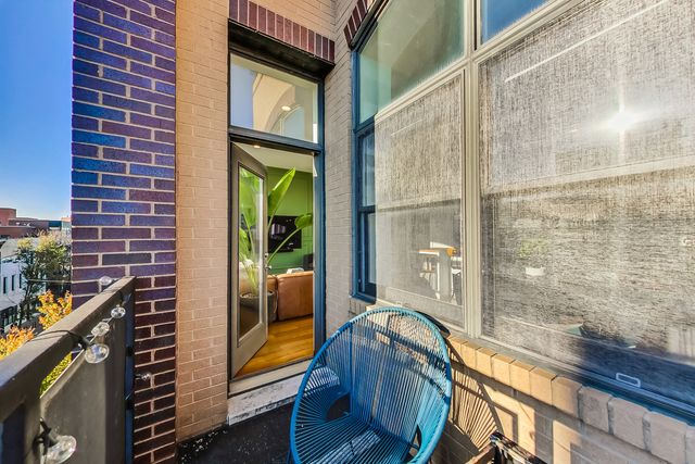 a view of balcony with a door and wooden floor