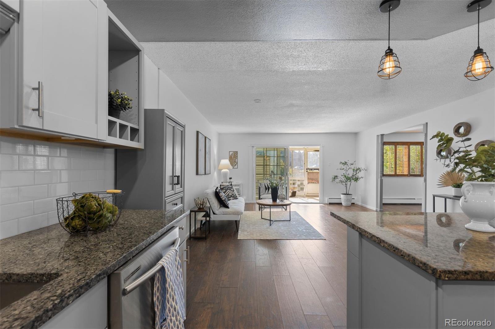 610 South Clinton Street, Unit 10A Denver, CO 80247 - Photo 14 of 40 a kitchen with sink stove and cabinets