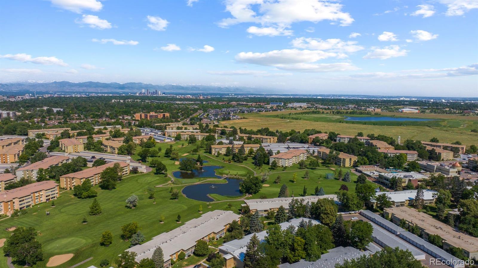 610 South Clinton Street, Unit 10A Denver, CO 80247 - Photo 36 of 40 a view of a city with mountains in the background