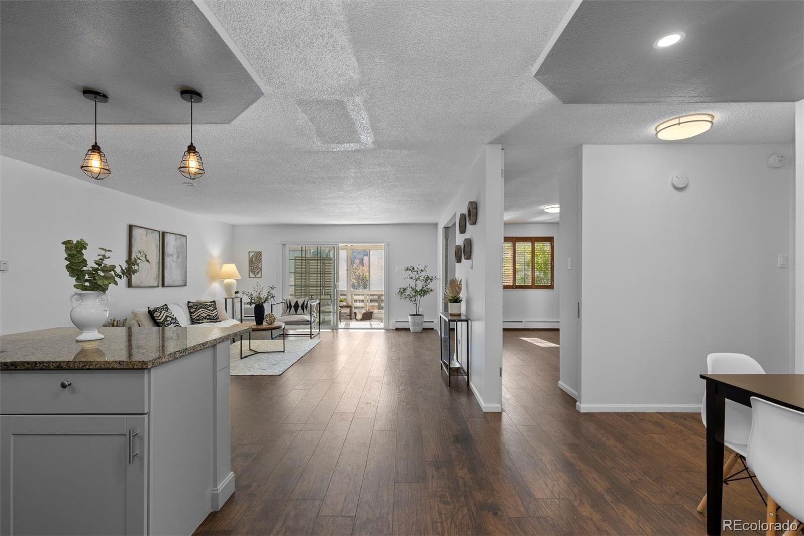 610 South Clinton Street, Unit 10A Denver, CO 80247 - Photo 5 of 40 a very nice looking living room with wooden floor