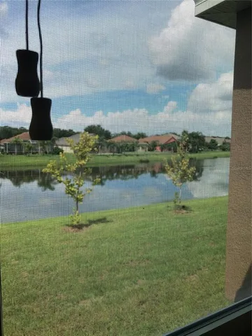 a view of a garden with a lake view