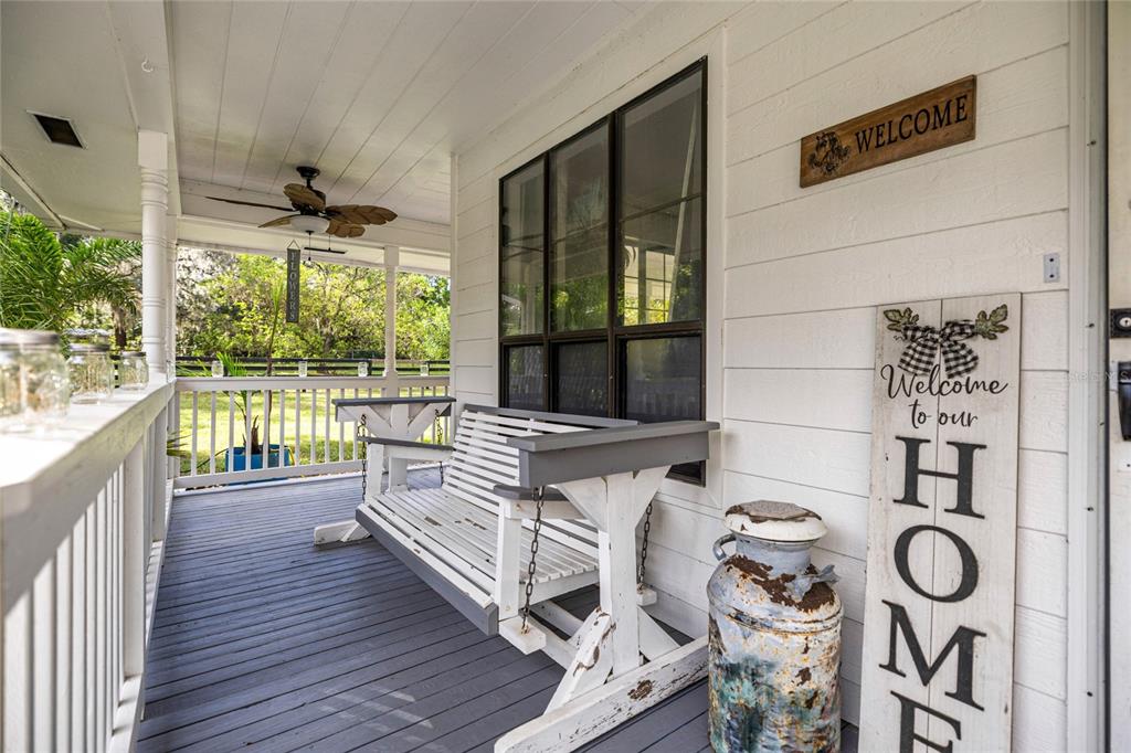 10245 Southwest 105th Street Ocala, FL 34481 - Photo 11 of 83 a view of a roof deck with furniture and wooden floor