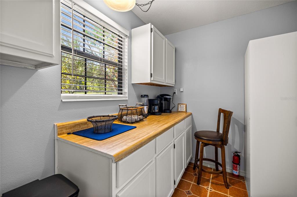 10245 Southwest 105th Street Ocala, FL 34481 - Photo 21 of 83 a utility room with sink a washer and dryer