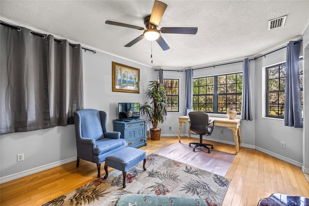 10245 Southwest 105th Street Ocala, FL 34481 - Photo 24 of 83 a living room with furniture pool table and a window