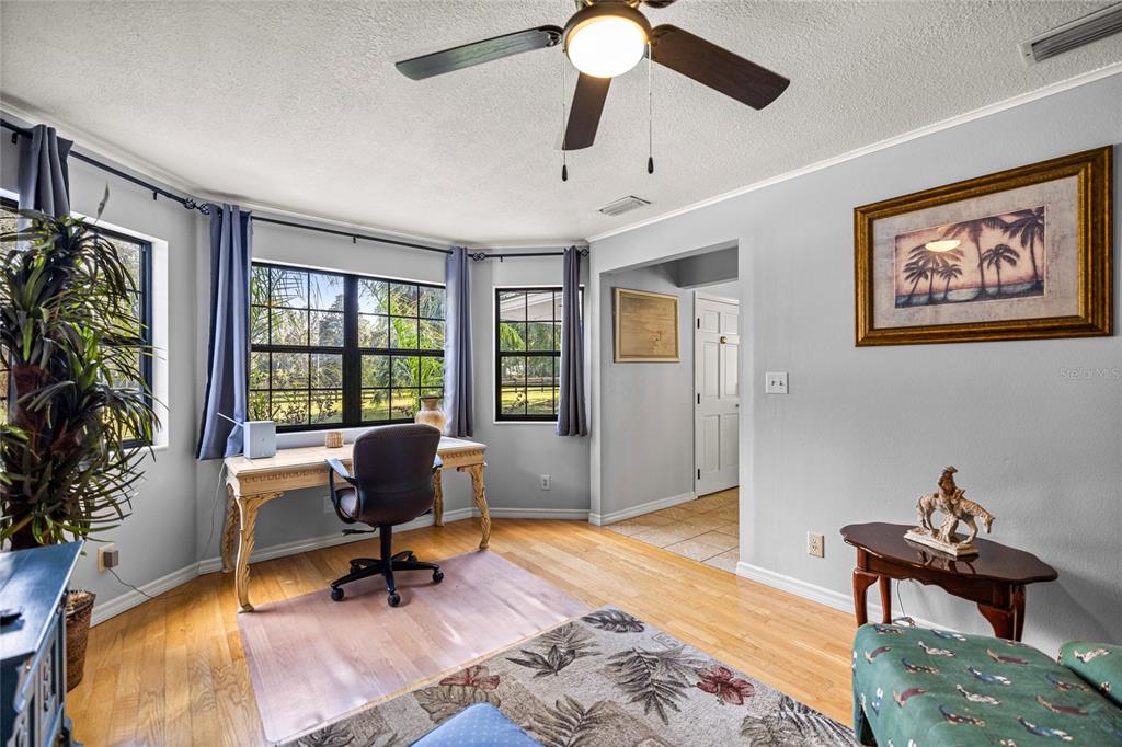 10245 Southwest 105th Street Ocala, FL 34481 - Photo 26 of 83 a living room with furniture and a window