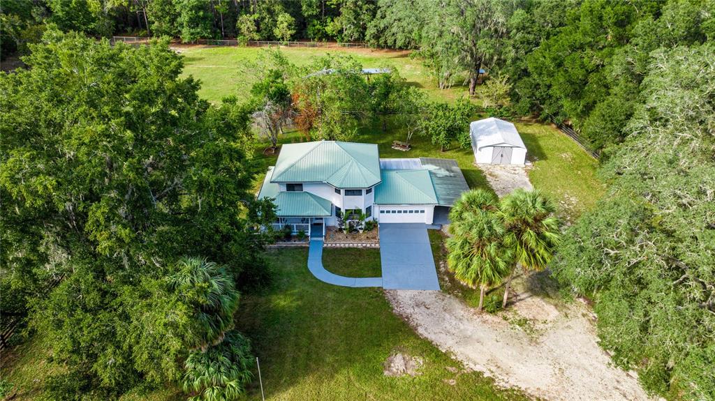 10245 Southwest 105th Street Ocala, FL 34481 - Photo 4 of 83 a garden view with a seating space