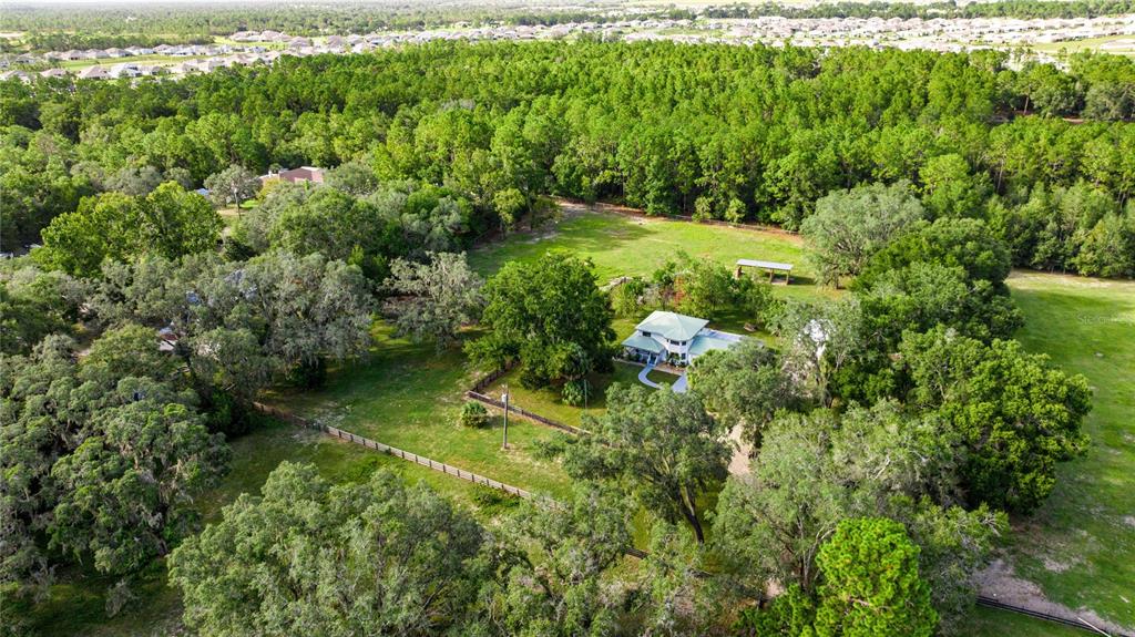 10245 Southwest 105th Street Ocala, FL 34481 - Photo 60 of 83 a view of a garden with a building