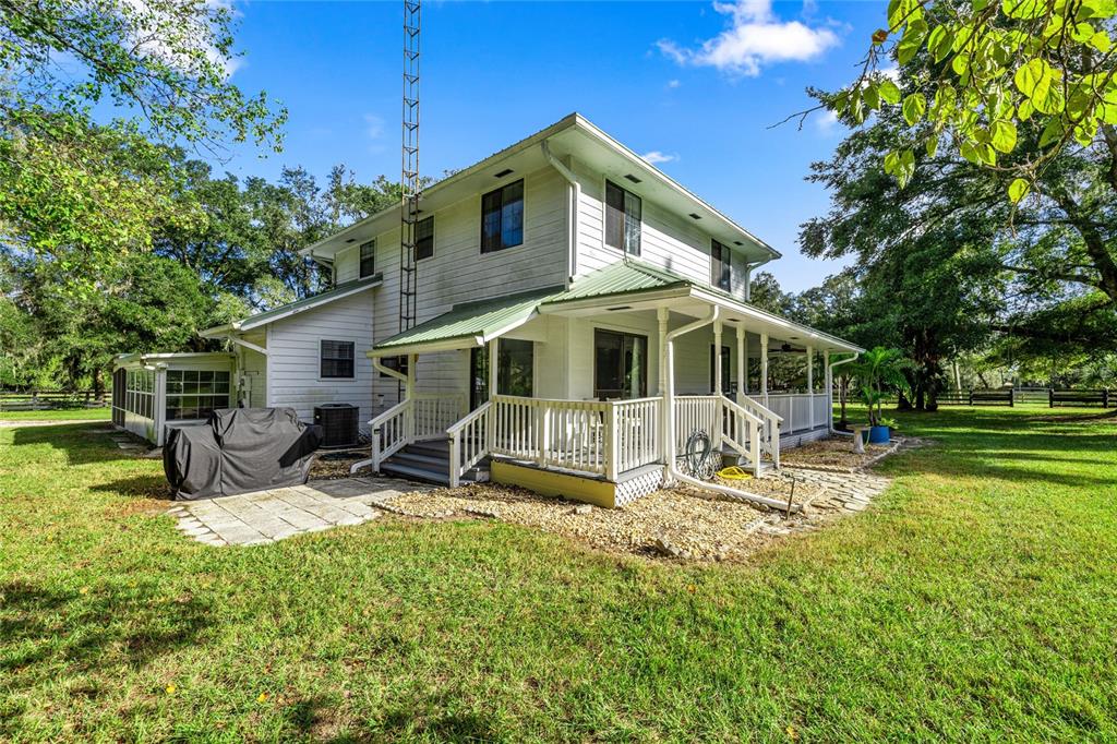 10245 Southwest 105th Street Ocala, FL 34481 - Photo 6 of 83 a house view with a sitting space garden view with a sitting space