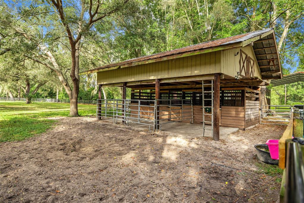 10245 Southwest 105th Street Ocala, FL 34481 - Photo 71 of 83 a view of a house with yard and porch