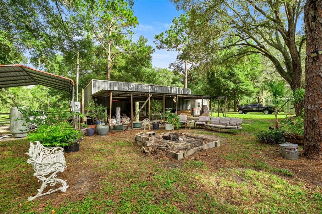 10245 Southwest 105th Street Ocala, FL 34481 - Photo 75 of 83 a view of backyard of house with green space and patio area