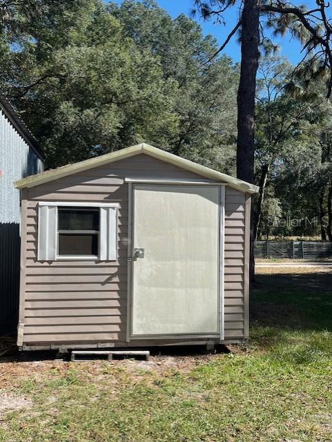 10245 Southwest 105th Street Ocala, FL 34481 - Photo 79 of 83 a side view of a house with a yard