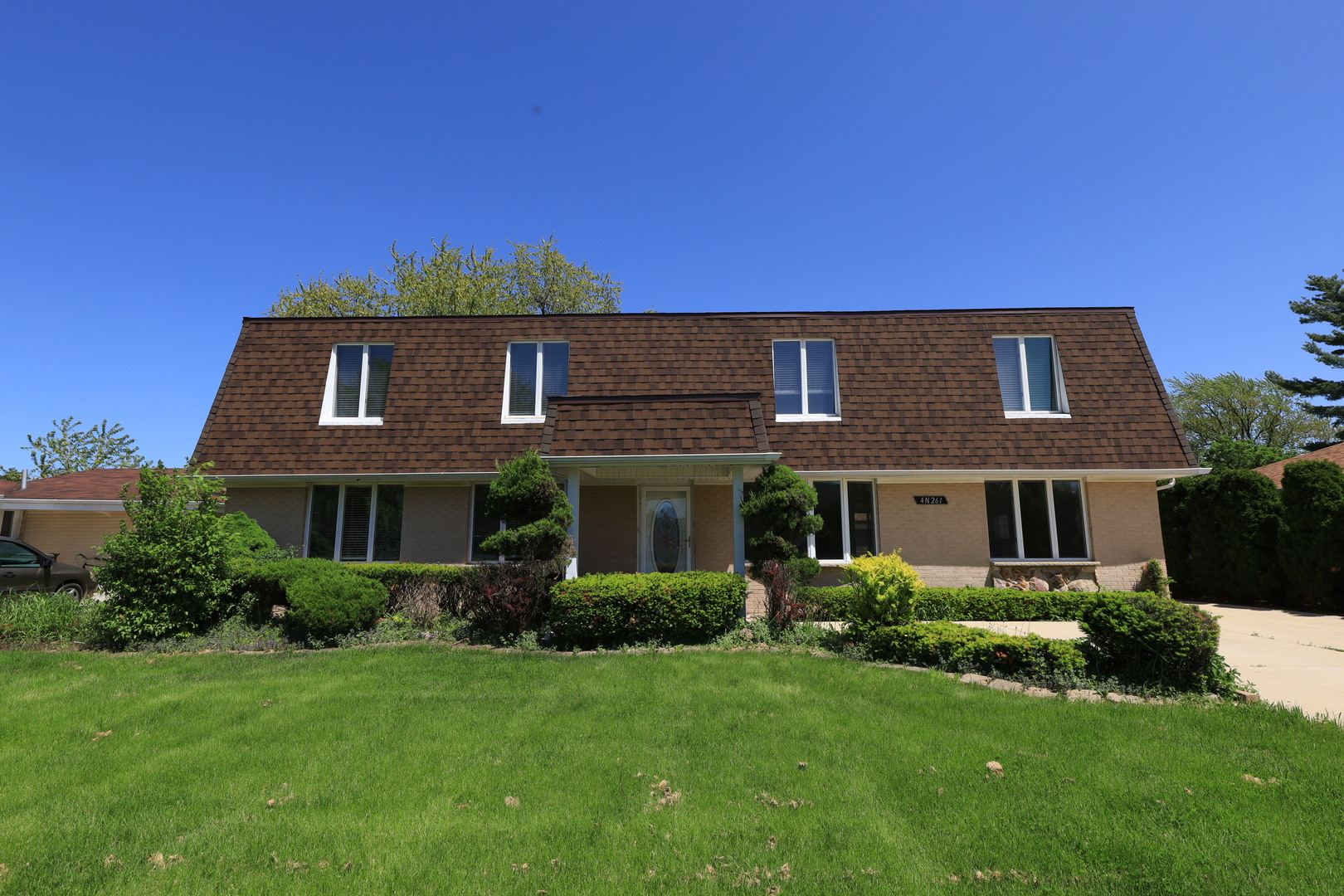 a front view of a house with a yard