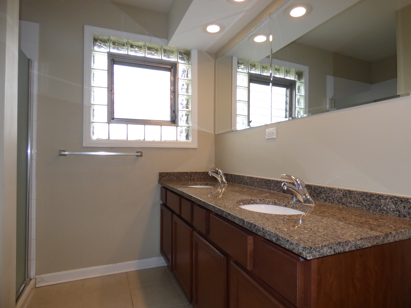 4N261 7th Avenue Addison, IL 60101 - Photo 14 of 31 a bathroom with a granite countertop sink and a mirror