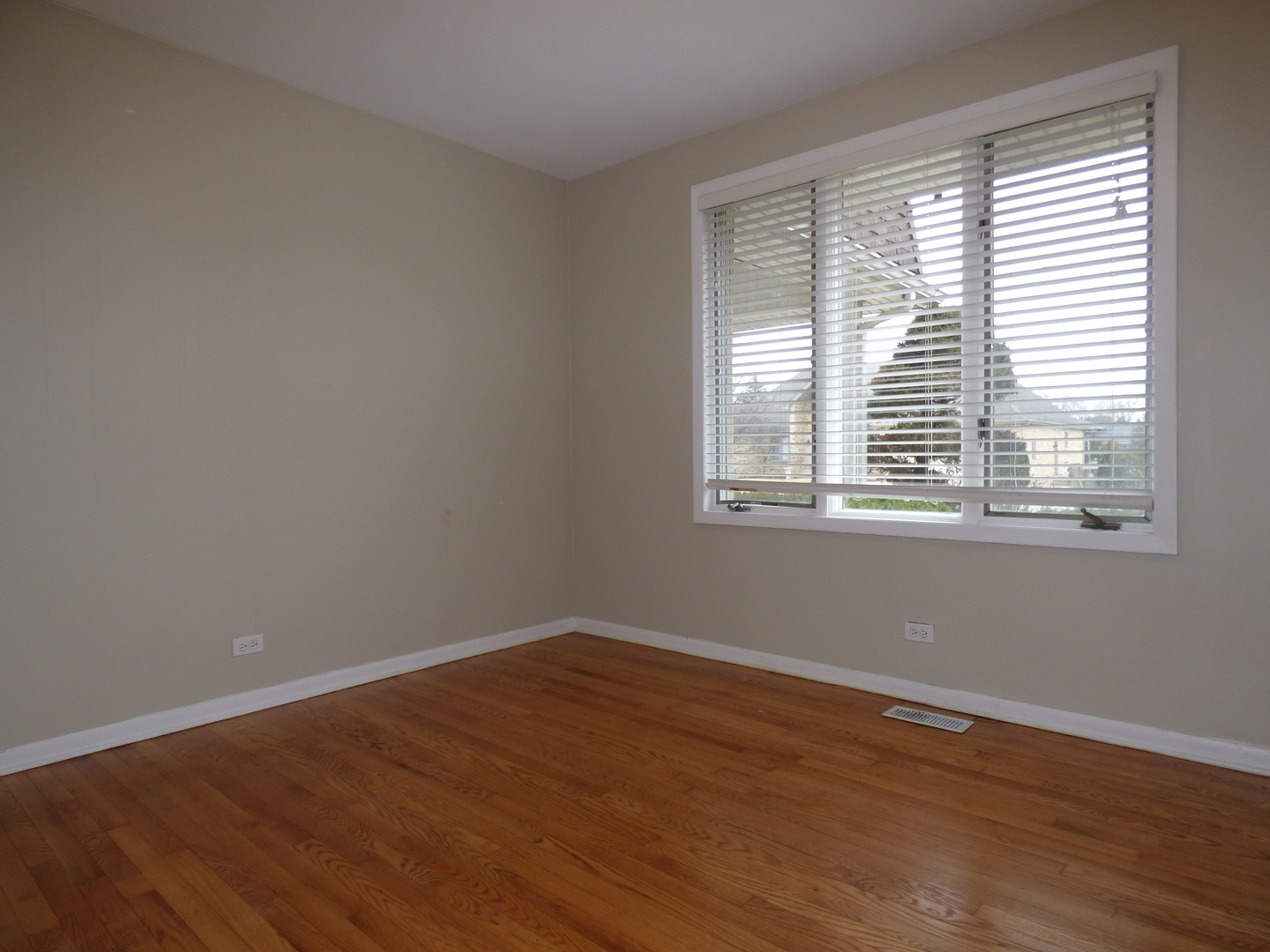 4N261 7th Avenue Addison, IL 60101 - Photo 9 of 31 a view of a room with wooden floor and a window