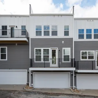 a front view of a house with a garage