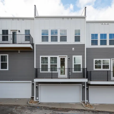 a front view of a house with a garage