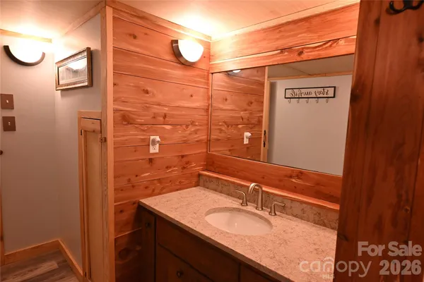 a bathroom with a shower and a sink