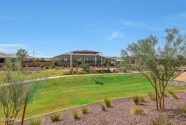 a view of a big house with a big yard