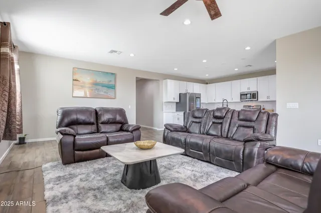 a living room with furniture and a rug